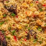 Plate of coconut rice served warm with rich aroma and texture.